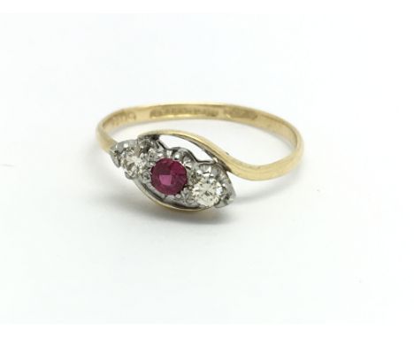 An 18ct yellow gold ruby and diamond ring, approx size K