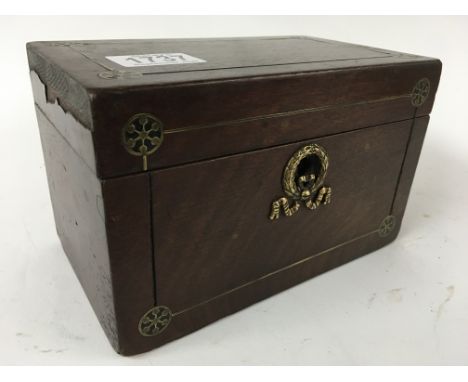 A Victorian mahogany tea caddy with brass inlay