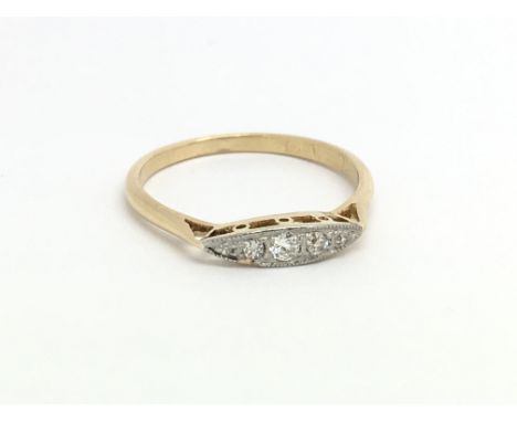 An 18ct yellow gold vintage ring having five small diamonds, ring size approx M/N