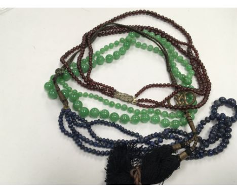 A Vintage jade necklace and two other necklaces. (3)