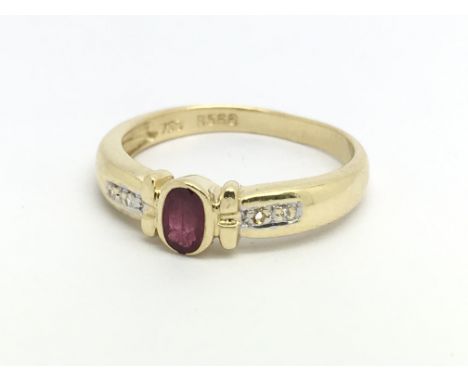 An 18ct yellow gold ruby and small diamond ring, size approx M