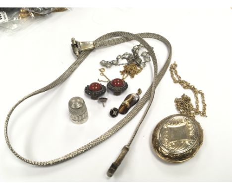 A white metal necklace a silver thimble and earrings a silver compact and other oddments.