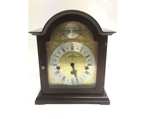 An arch topped mantle clock.