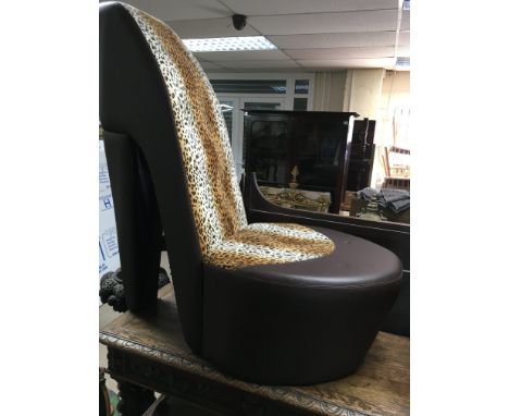 A Novelty chair in the form of a High heel shoe With leopard print - NO RESERVE
