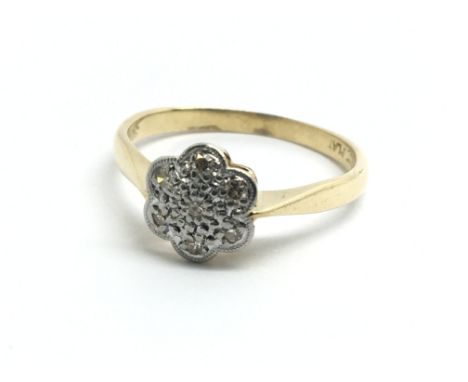 An 18ct yellow gold and seven stone diamond ring, ring size approx K