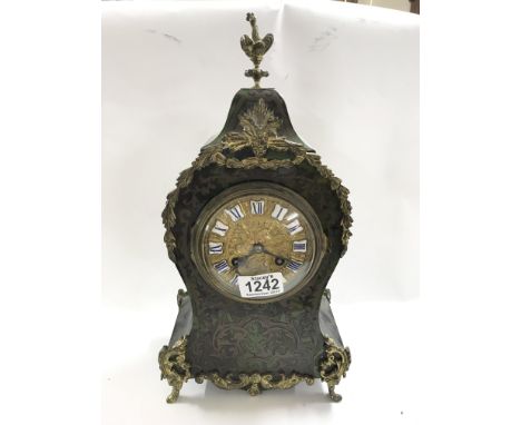 A French boulle green tortoiseshell brass inlaid mantel clock with gilt mounts
