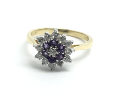 An 18ct yellow gold amethyst and diamond cluster ring, size approx L