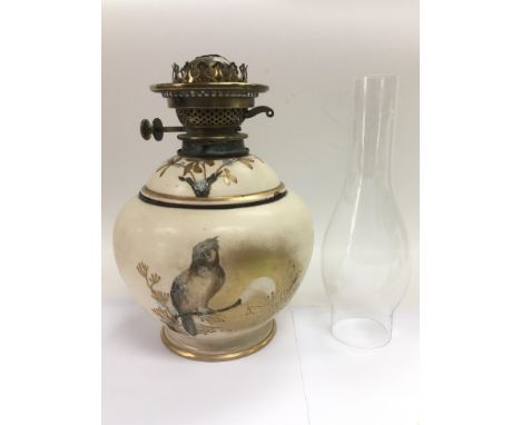 A 19th Century ceramic oil lamp painted with a bird and swallows to the reverse - NO RESERVE