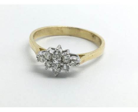 An 18ct yellow gold ring set with a cluster of nine diamonds, approx 0.20ct, ring size approx L/M