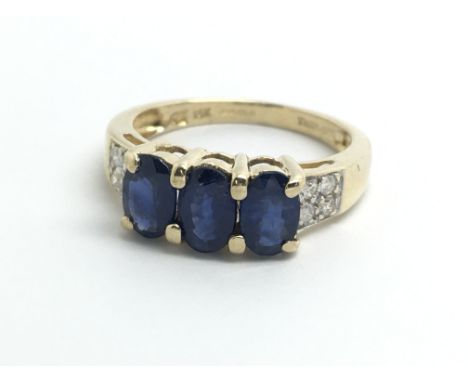 An 18ct yellow gold sapphire and diamond ring, size approx I/J