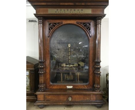 A Douglas &amp; Co of London polyphon with five 15 1/2 inch discs.