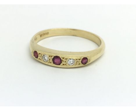 An 18ct yellow gold, diamond and ruby ring, size approx N