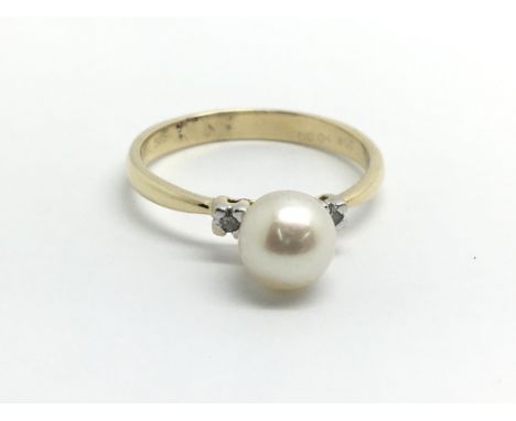 A 14ct yellow gold, diamond and pearl ring, size approx N