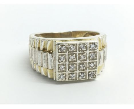 A gents silver and sixteen stone ring, approx size P/Q