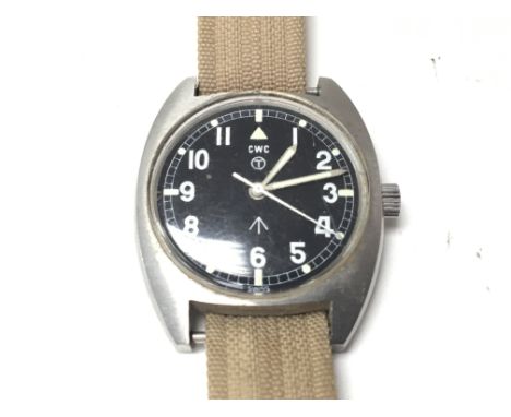 A Genuine Military issue manual wind CWC watch with illuminated black dial canvas type strap full working order.