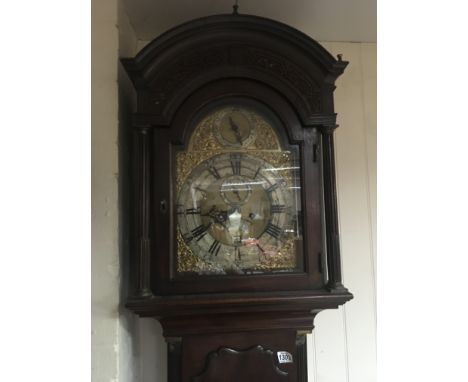 A Quality 18th century George III mahogany long case clock with a brass dial and silver chapter ring maker Mathew Holland Lon