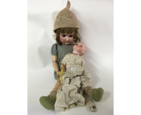 A small Armand Marseille porcelain doll 341/2.K plus a further large Armand Marseille Doll 390/8.