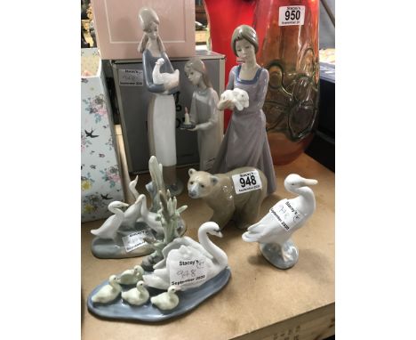 Five Lladro figures and two Nao examples (7).