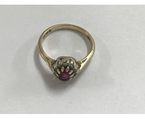 A 9 ct ring inset with a ruby size N total weight 3 grams.