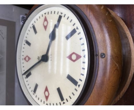A double sided G P O clock .dial 25 cm , glass broken to one side .
