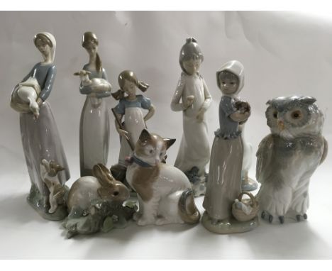 A collection of Lladro and NAO figures various.