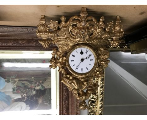 A small French ornate gilt clock.