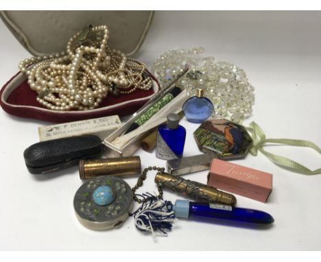 A collection of costume jewellery and vintage makeup and perfume items.