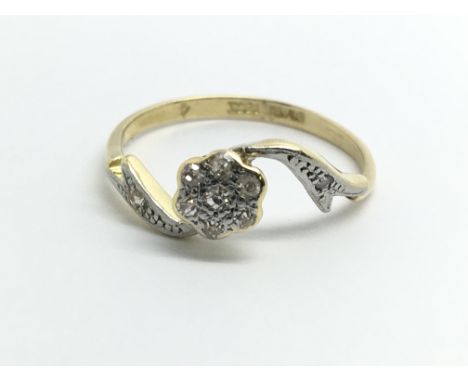 A 1930s ring with diamond rose shape cluster, size approx P