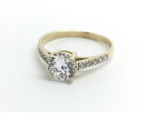 A 9ct yellow gold and moissanite solitaire, ring size approx Q/R