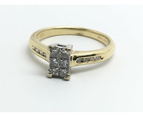 An 18ct yellow gold ring, set with six central diamonds and another four diamonds on each shoulder, approx 0.35ct, ring size 