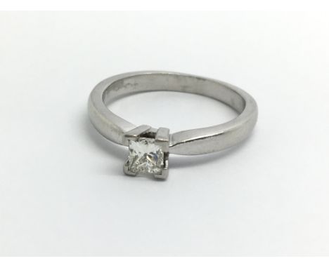 An 18ct white gold ring set with a princess cut diamond solitaire, approx 0.33ct, ring size approx J