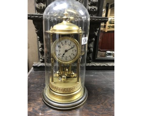 A large French brass Anniversary clock under dome, 42.5cm.