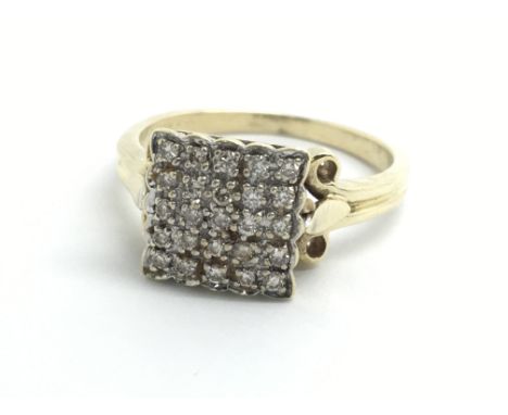 A 9ct yellow gold ring set with a cluster of five rows of five diamonds, size approx O/P