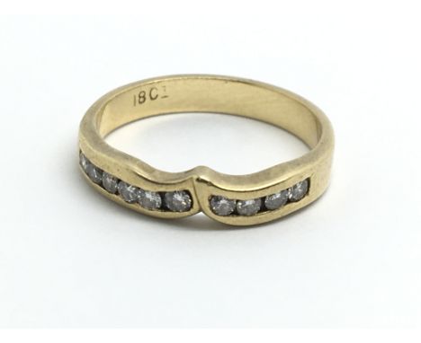 An 18ct yellow gold and diamond wishbone style ring, approx 0.25ct, ring size approx J/K