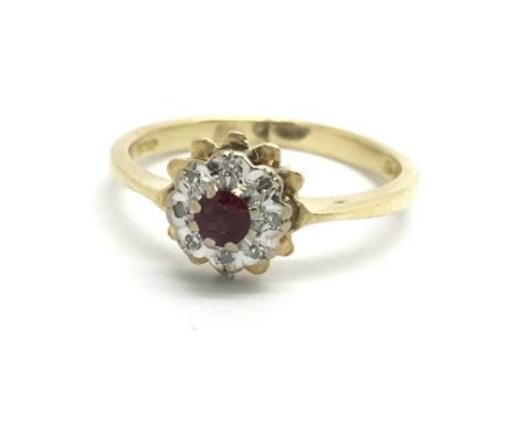 An 18ct yellow gold ruby and diamond cluster ring, size approx I