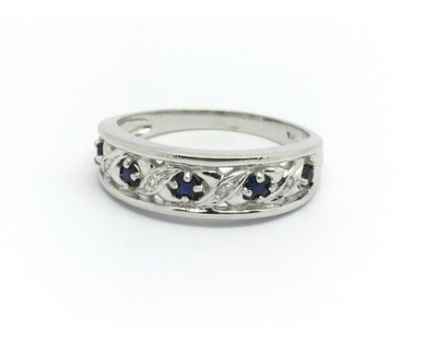 A 9ct white gold, sapphire and small diamond ring, size approx R