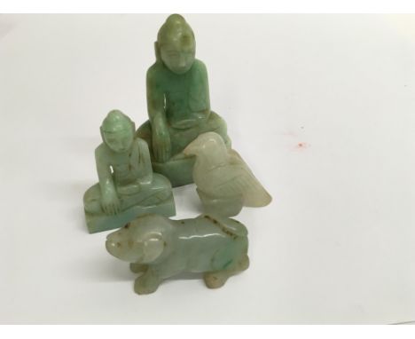 A collection of four jade figures in the form of Buddha, a bird and a dog of Fo . 7 cm down.