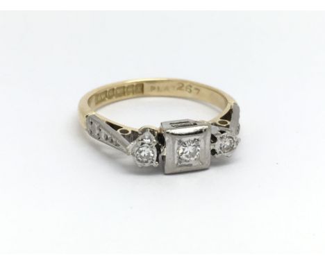 An 18ct yellow gold vintage ring with three diamonds, ring size approx G/H