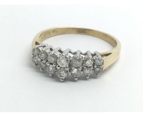 An 18ct yellow gold ring with two rows of diamonds, approx 0.5ct, ring size approx O/P