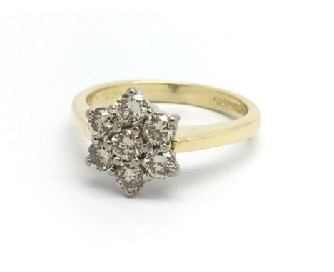 An 18ct yellow gold seven stone diamond ring in the shape of a rose, approx 0.75ct, ring size approx K/L