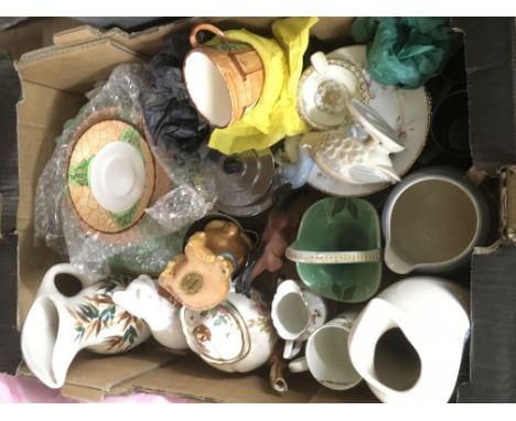 A box of various ceramic and glass items.