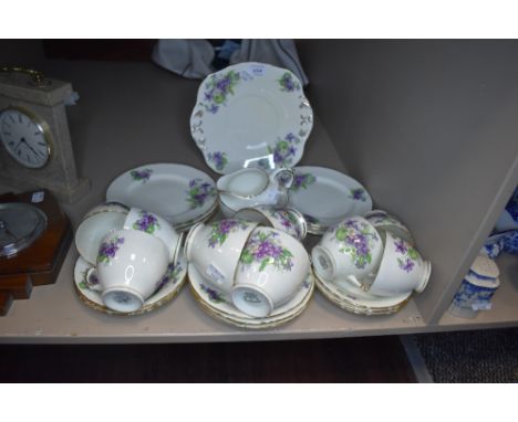A part tea service by Sutherland HM bone China with transfer print design