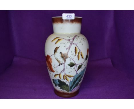 An opal glass vase with hand painted scenes of nature and Wren bird