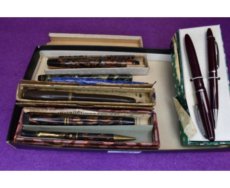A selection of fountain pens, mainly for parts including Parker 51 in burgundy with a gold cap, a Parker Duofold  a Burnham N