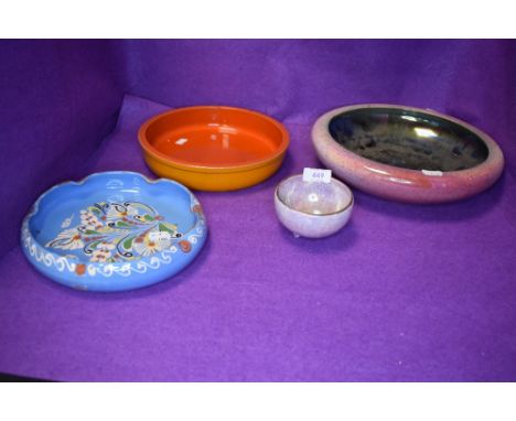 A selection of ceramic dishes including Byzanta ware and delft style