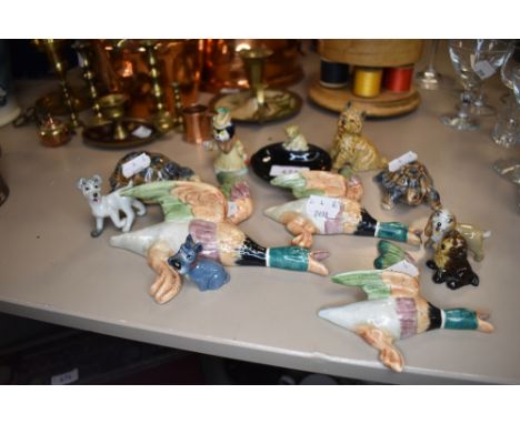 A selection of collectable figures and figurines including graduated ceramic duck wall set