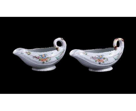 A PAIR OF WORCESTER COS LETTUCE LEAF-SHAPED SAUCEBOATSCIRCA 1760Painted with flowers, un-markedeach 18cm in length Provenance