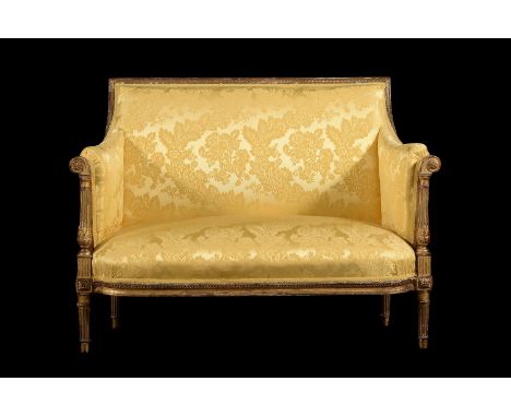 A FRENCH GILTWOOD AND YELLOW DAMASK UPHOLSTERED TWO-SEAT SOFA OR CANAPEIN LOUIS XVI STYLE, 19TH CENTURY 97cm high, 127cm wide