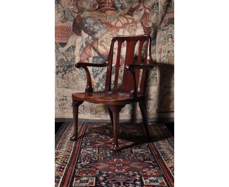 A GEORGE II MAHOGANY HALL CHAIRPOSSIBLY IRISH, CIRCA 1730Of 'saddle seated' type95cm high, 65cm wide, 58cm deepProvenance: Ho