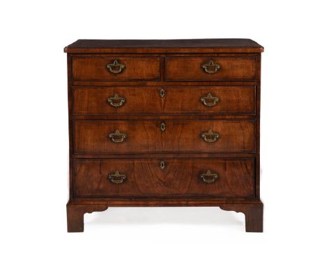 A GEORGE II FIGURED WALNUT, CROSSBANDED AND LINE INLAID CHEST OF DRAWERSCIRCA 1740 93cm high, 95cm wide, 51cm deep Provenance